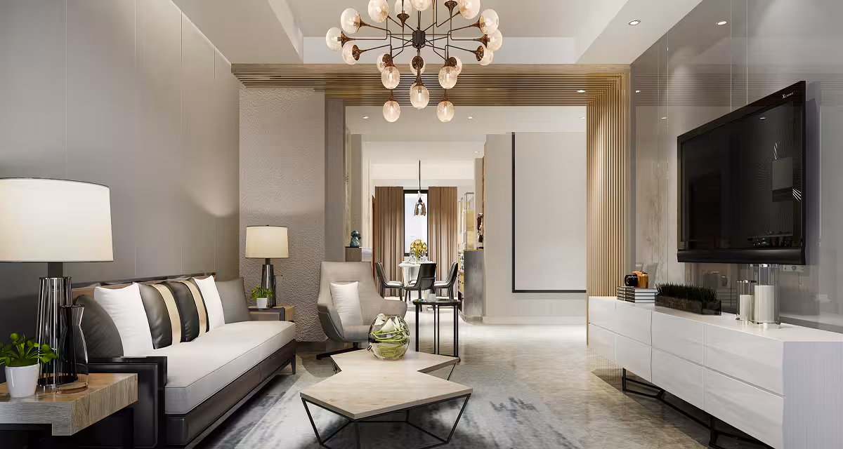 Modern living room with beige sofa, armchair, geometric coffee tables, wall-mounted TV, and chandelier.